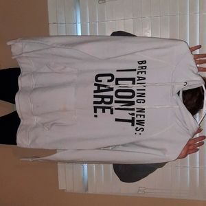 Casual comfy white hoodie that says "Breaking News: I Don't Care"